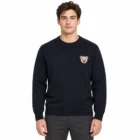 Male model wearing the navy chest motif crew neck sweater