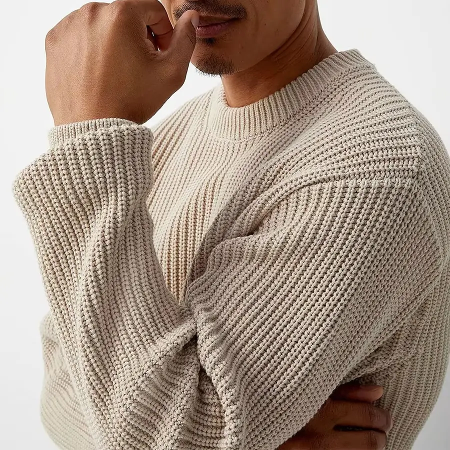 Close-up of the ribbed knit texture on the chunky cotton sweater