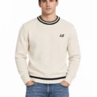 Custom stripe embroidered sweater in cream on male model, front view