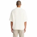 Back view of the cream cotton cable knit open V neck sweater