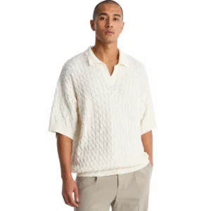 Cream cotton cable knit polo sweater with an open V neck worn by a male model