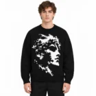 Male model wearing the black cotton jacquard sweater with crew neck and long sleeves