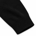 Ribbed knit cuff detail on the black cotton jacquard sweater sleeve