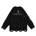 Back view of the black sweater with an emblem above two lines of reversed gothic lettering and a dagger motif on the sleeve
