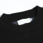Close-up of the black ribbed crew collar with a blank white inner neck label and a small size tab