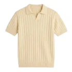 Cream short sleeve knit polo sweater with an open V neck and vertical rib knit