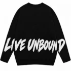 Back view of the black crew neck sweater with a knitted white LIVE UNBOUND slogan