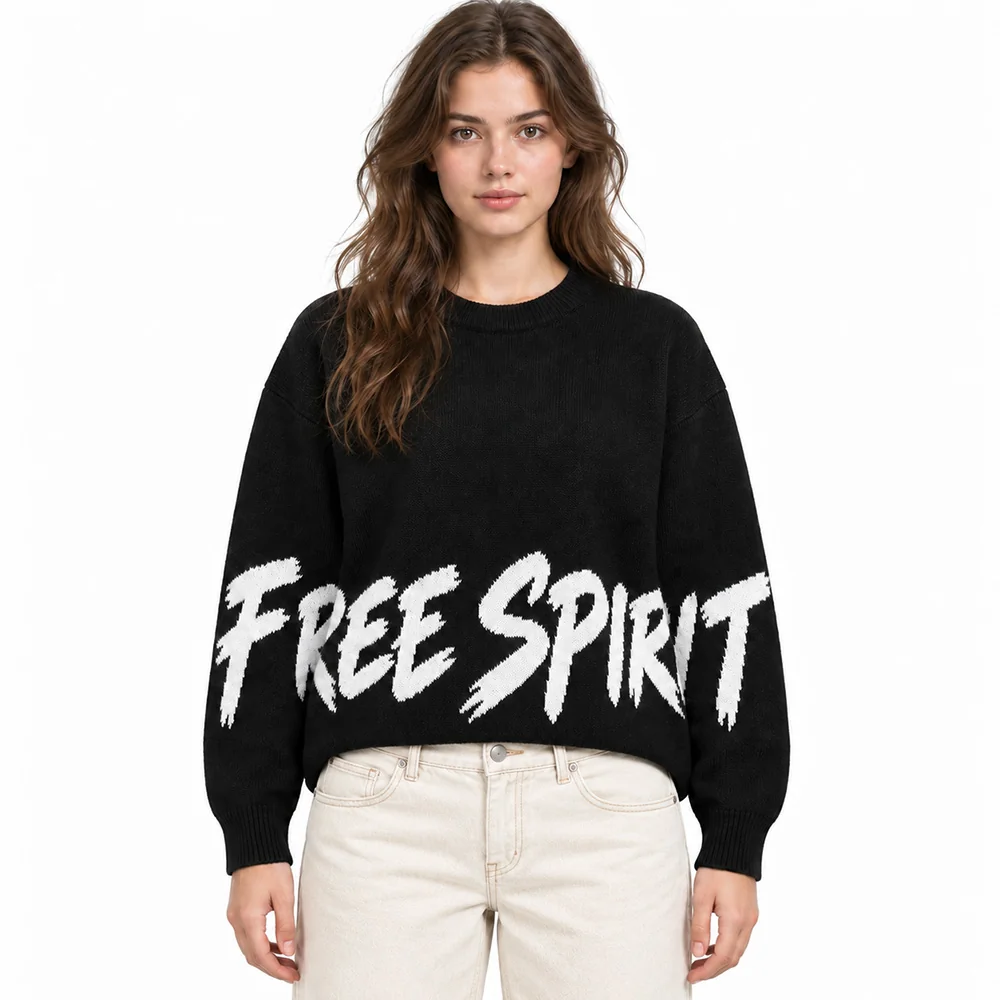 Female model wearing the black slogan jacquard crew neck sweater